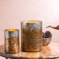 Cylinder glass candle holders on tabletop